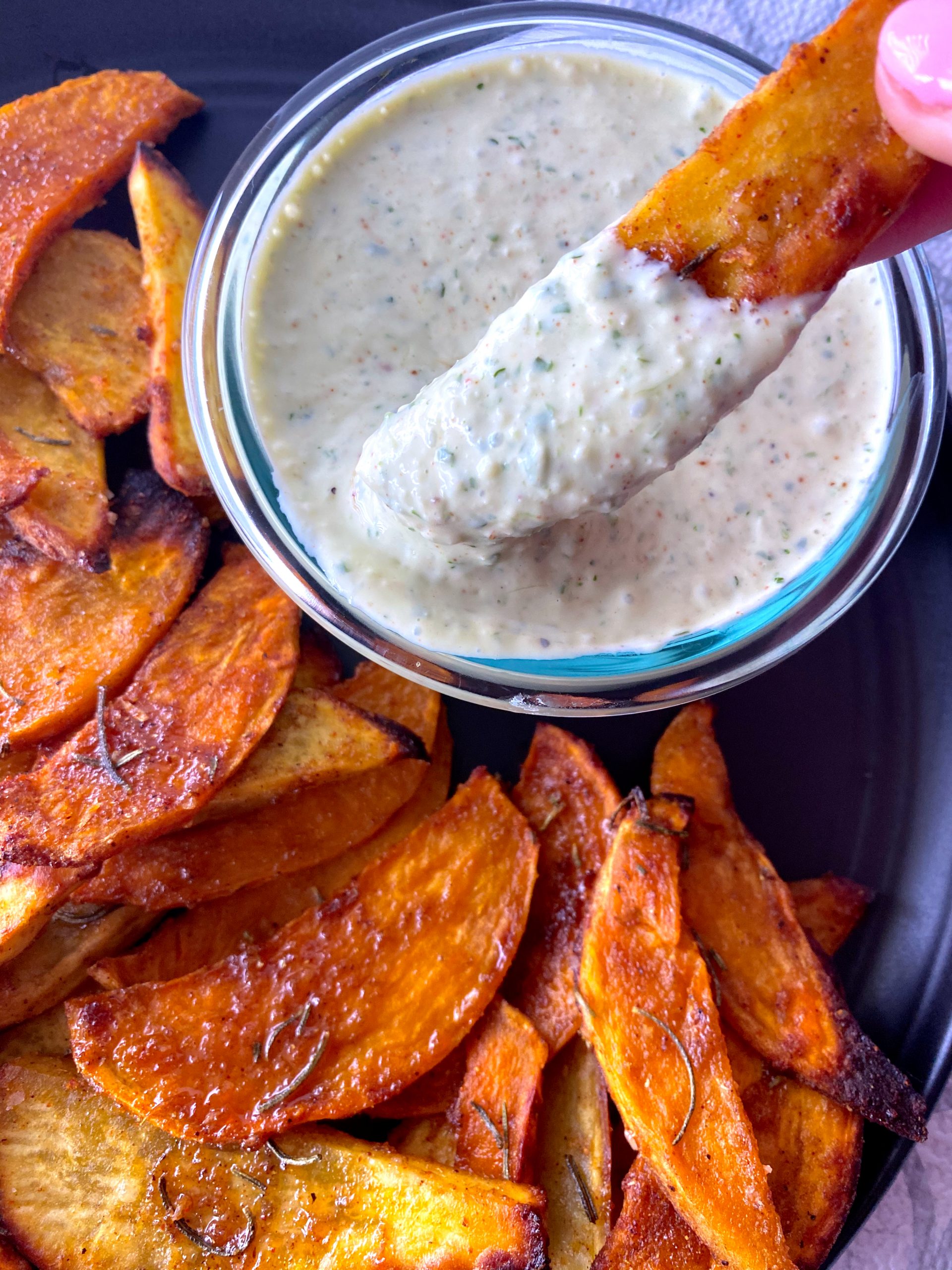 sweet potato fries dipped in yogurt sauce