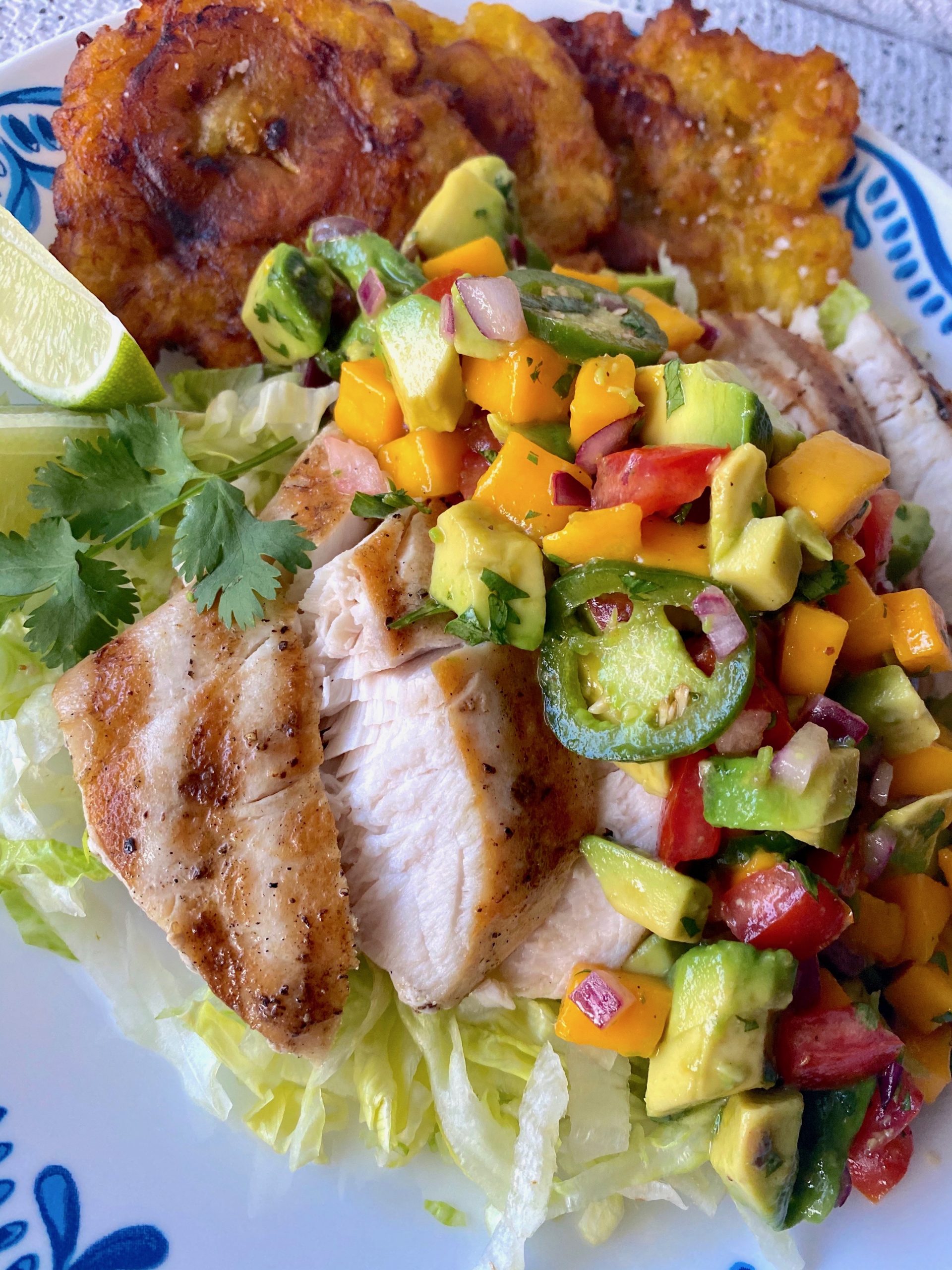 Grilled fish with mango & salsa on top